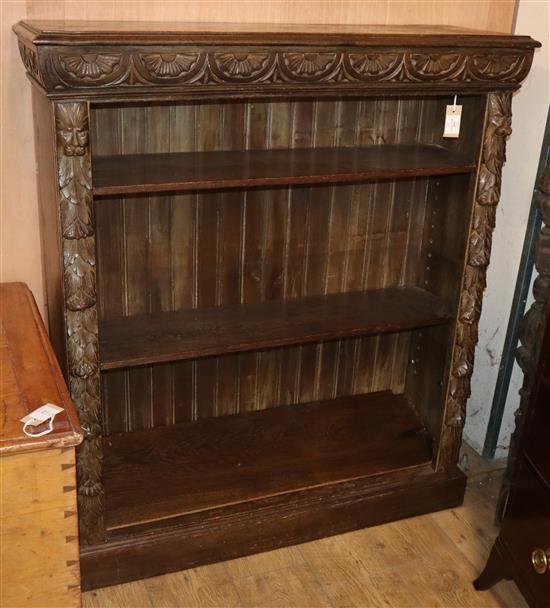 A late Victorian carved oak open bookcase W.106cm